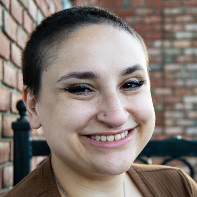 Self portrait photo of Gina Ienopoli smiling